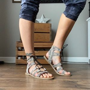 Zebra print, strappy flat sandal.